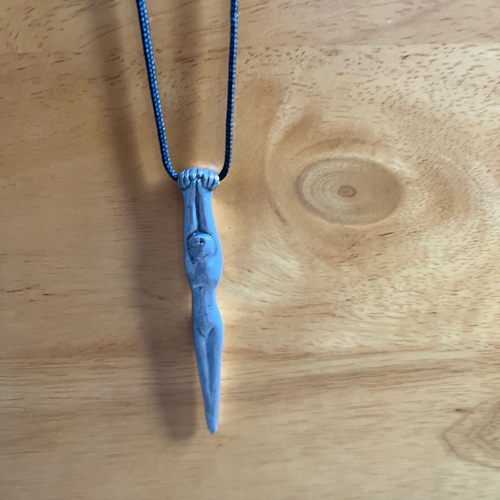 CARROL BOYES - pewter necklace on black cord.